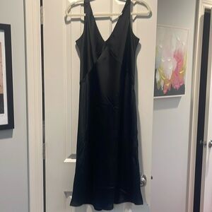 Black V neck slip dress. Slits on both sides.  Casual w/flops or wedding w/heels